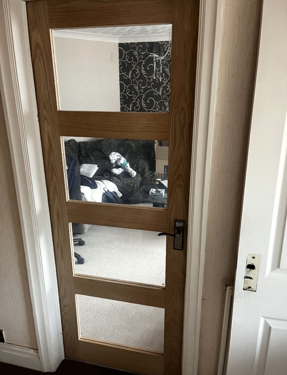 Installed internal oak door with glazed panels