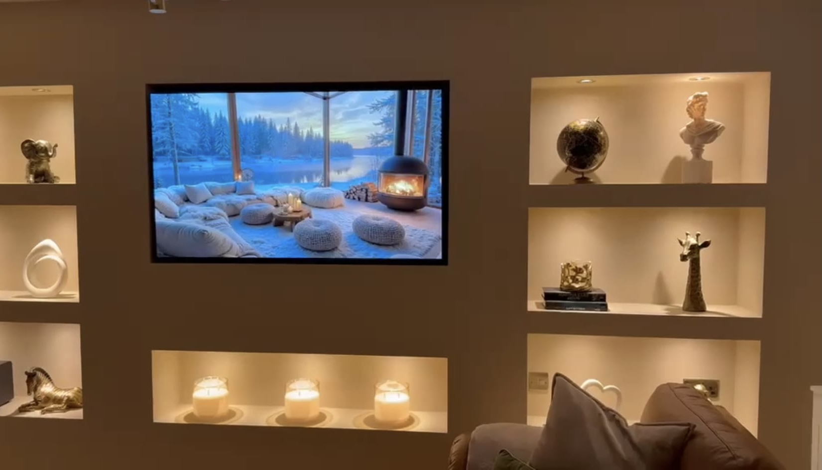 Finished display wall with shelving, lighting and media screen