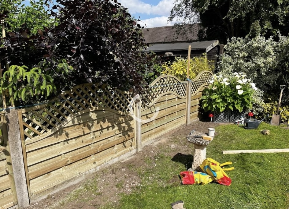 New garden fencing installation in a residential garden