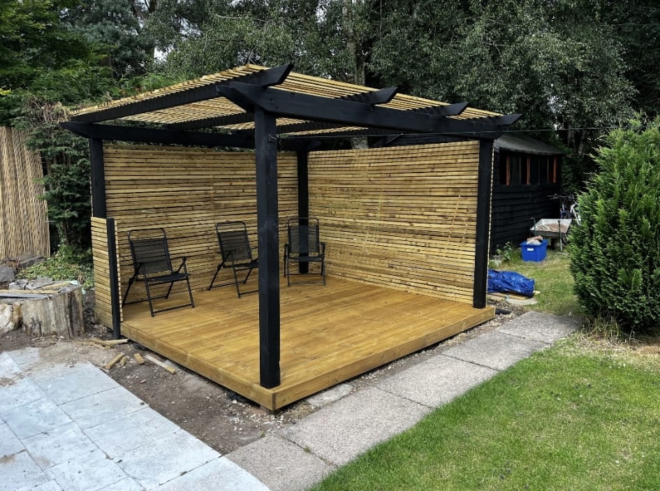 Completed timber pergola and decking area in a garden